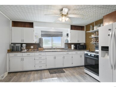 The big kitchen has lots of storage and brand new 