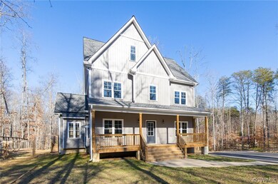 View of front facade with a front lawn and covered porch