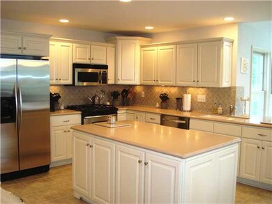 Kitchen. Cream Kitchen, Corian Counters-Stainless 