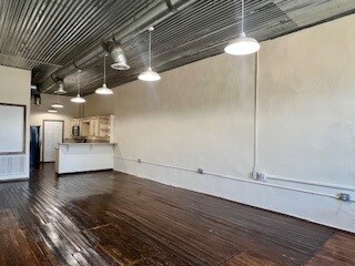 Loft living room, original hardwood floors and bre