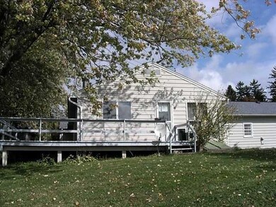 Exterior Back. Back of house with wrap around deck