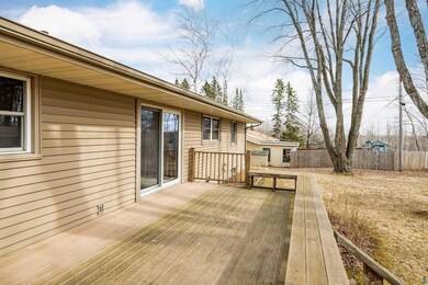 Wooden terrace featuring fence