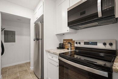 Kitchen featuring stainless steel appliances, ele
