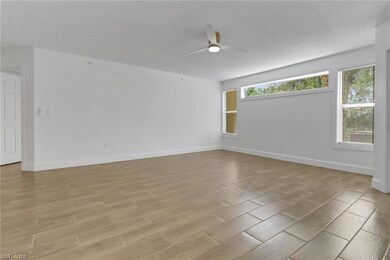 Empty room featuring light wood-type flooring, bas