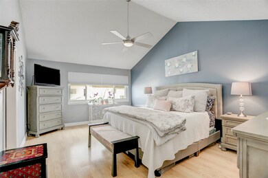 Large light and airy primary bedroom with high cat