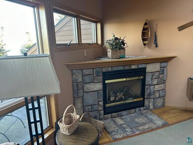 Interior details with a stone fireplace and hardwo