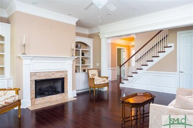 Living Room: Beautiful moldings, marble faced gas 