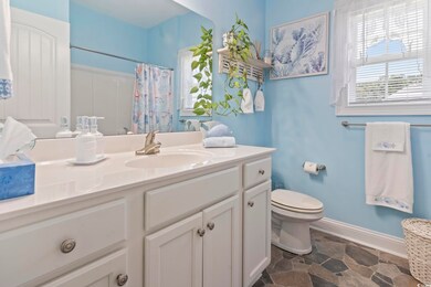 Bathroom featuring vanity, tile patterned floors, 