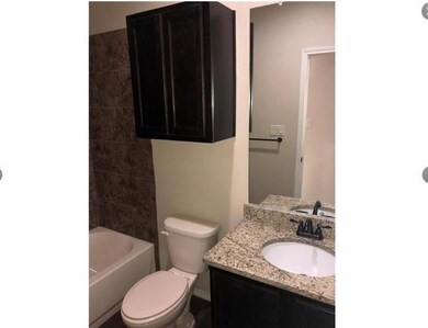 Full bath featuring vanity and shower / bath combination