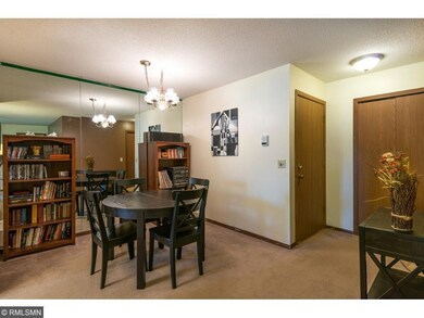 View of dining area and entry as you stand in the 