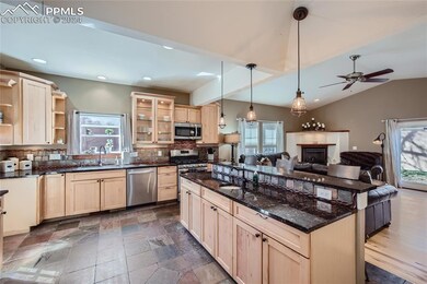 Gourmet kitchen with stone floor