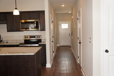 Example Photo of Hallway coming from the Front Door to the Kitchen and Great Room.