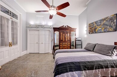Extra spacious bedroom has its own set of French d