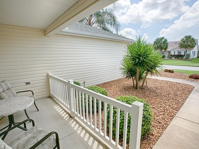 THIS CHARMING FRONT PORCH IS A GREAT PLACE TO RELA