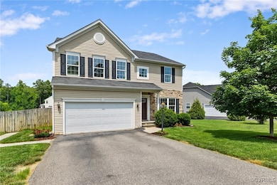 Traditional-style home with driveway and an attach