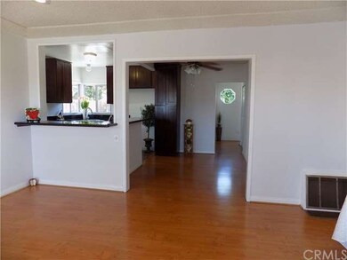Living room with laminate flooring, recessed light