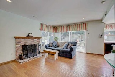 Family room with a fireplace and a large sliding d