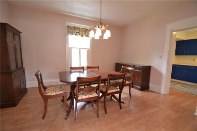 Dining room has plenty of space for large family m