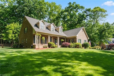 The home has an impressive presence on the lot surrounded by established trees and lawn.