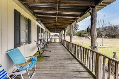 Deck featuring a playground and a lawn