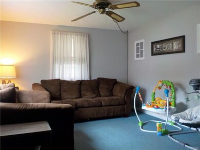 Living room with ceiling fan and loads of natural 