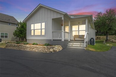 View of front facade with covered porch and board