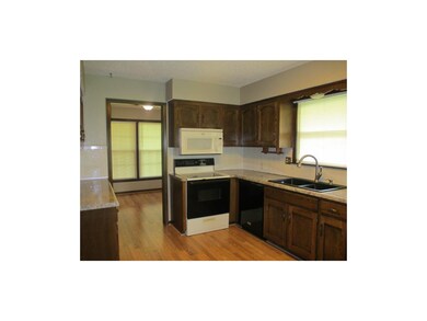 Kitchen and dining room has new flooring.  Stove a