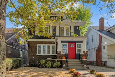 Traditional style home with brick siding