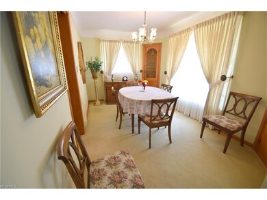 Formal dining room - wood floors under the carpeting