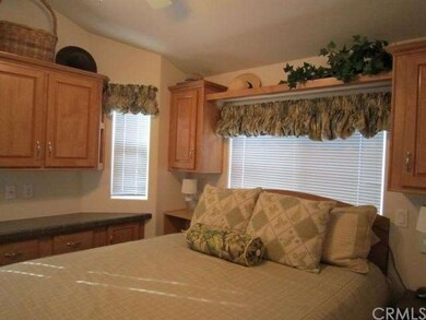 Bedroom with Ceiling Fan and A lot of Natural Ligh