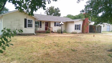 Ranch-style house with a front yard