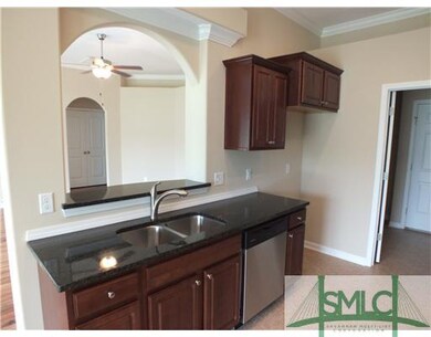 Kitchen. arched look through into the living room