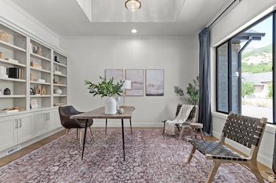 Home office with crown molding, wood finished floors, and recessed lighting