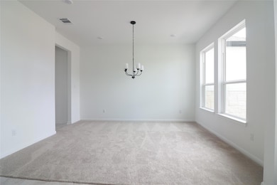 Unfurnished dining area featuring a chandelier, l