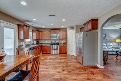Just off the arched entryway is the large kitchen and dining area.