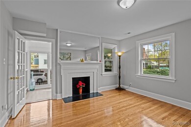 Unfurnished living room with baseboards, a firepla