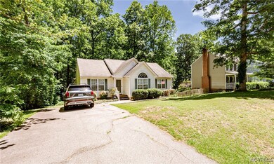 View of front of property with driveway and a fron