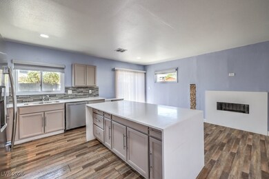 Kitchen with decorative backsplash, light countert