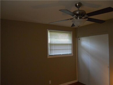Bedroom 1 With Large Closet and Hardwood Flooring