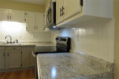 White ceramic tile provides the perfect backsplash