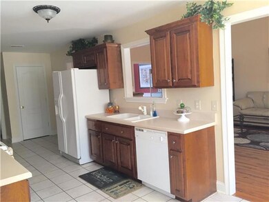 Convenient kitchen has tile floor.
