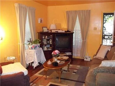Spacious Living room with hardwood floors.