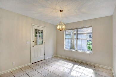 Nice & bright dining area with tiled floors opens
