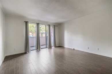 Spacious living room with access to a private pati