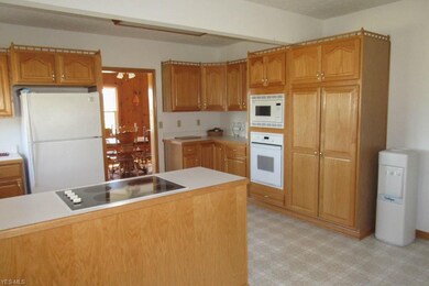Fully applianced kitchen with a pantry.