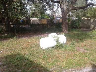 Large back yard with a propane tank for cooking