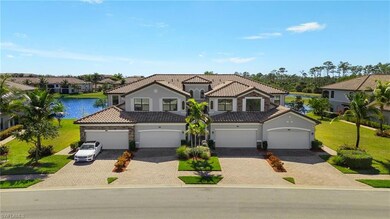Front of home with 2 car attached garage, lawn and