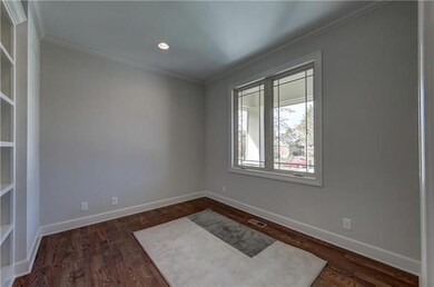Main floor office, library or playroom with hardwo