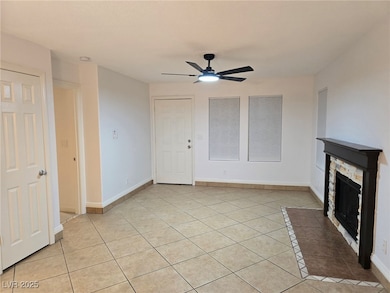 Unfurnished living room featuring light tile patte