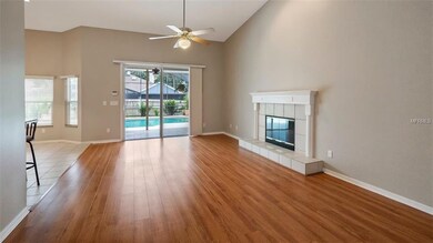 Family Room with wood burning Fireplace overlooks 
